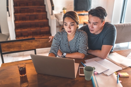 Couple making plans at computer