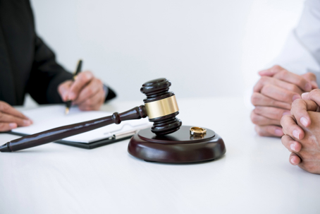 divorcing couple speaking to a lawyer
