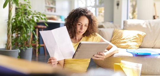 Woman looking over paperwork