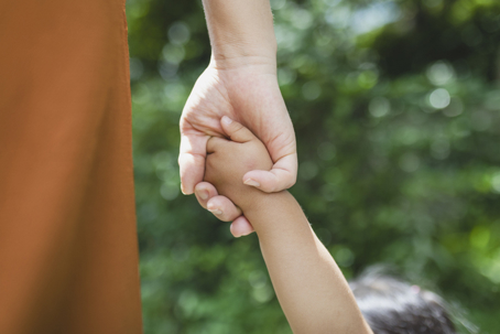 parent and child holding hands
