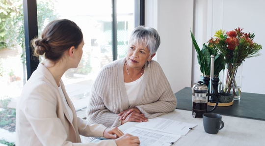 elderly woman with estate planning lawyer