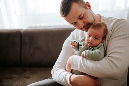 father holding his baby
