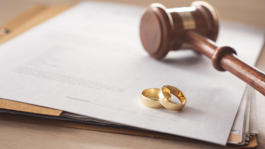 documents, wedding rings, and a gavel