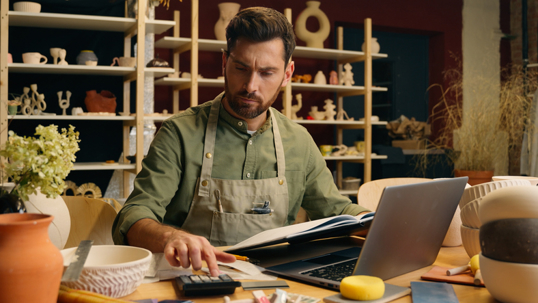 business owner calculating money